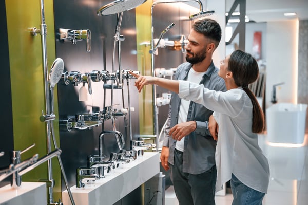 having-fun-looking-bath-cranes-woman-man-is-store-goods-home